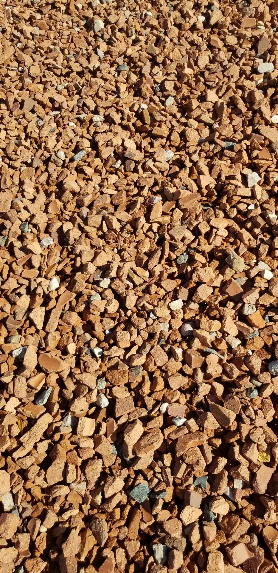 Close-up of brown gravel stones on ground