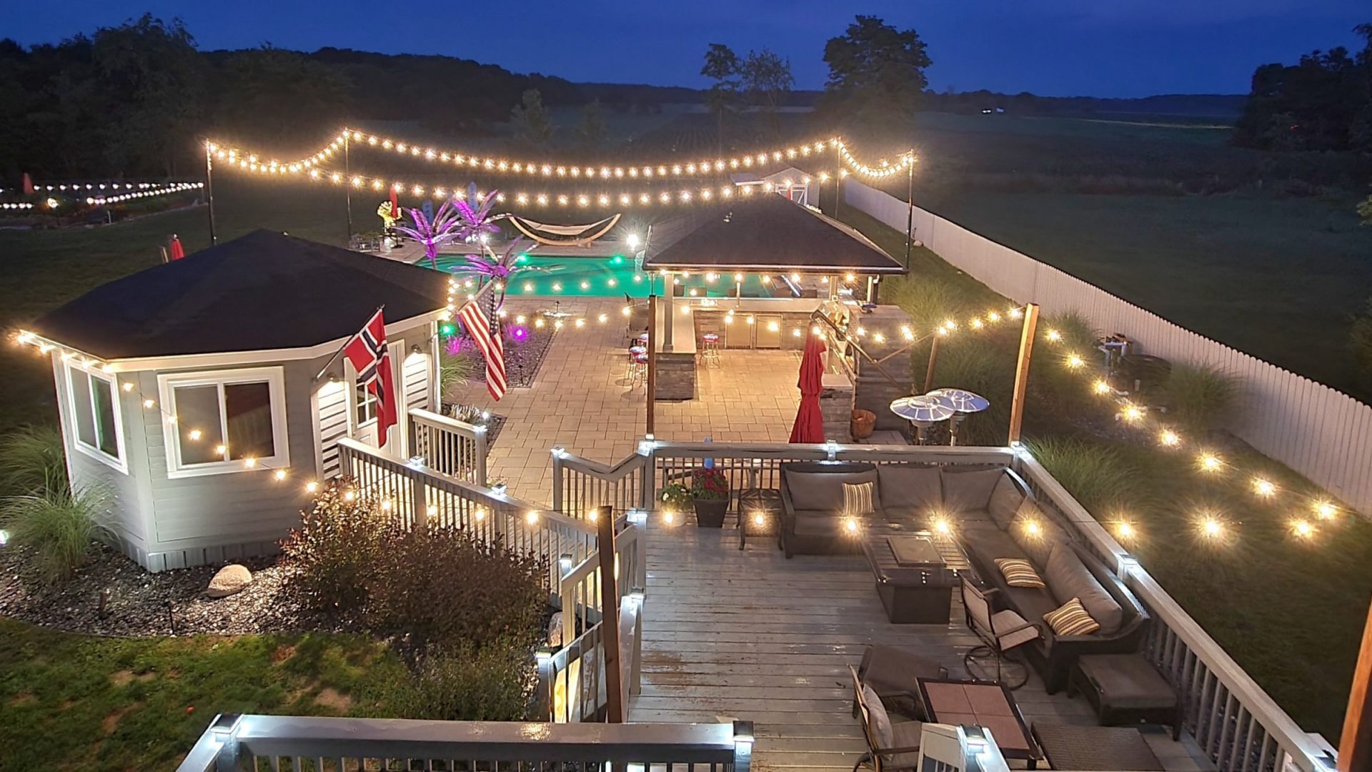 a lounge where an outdoor kitchen for cooking and dining 