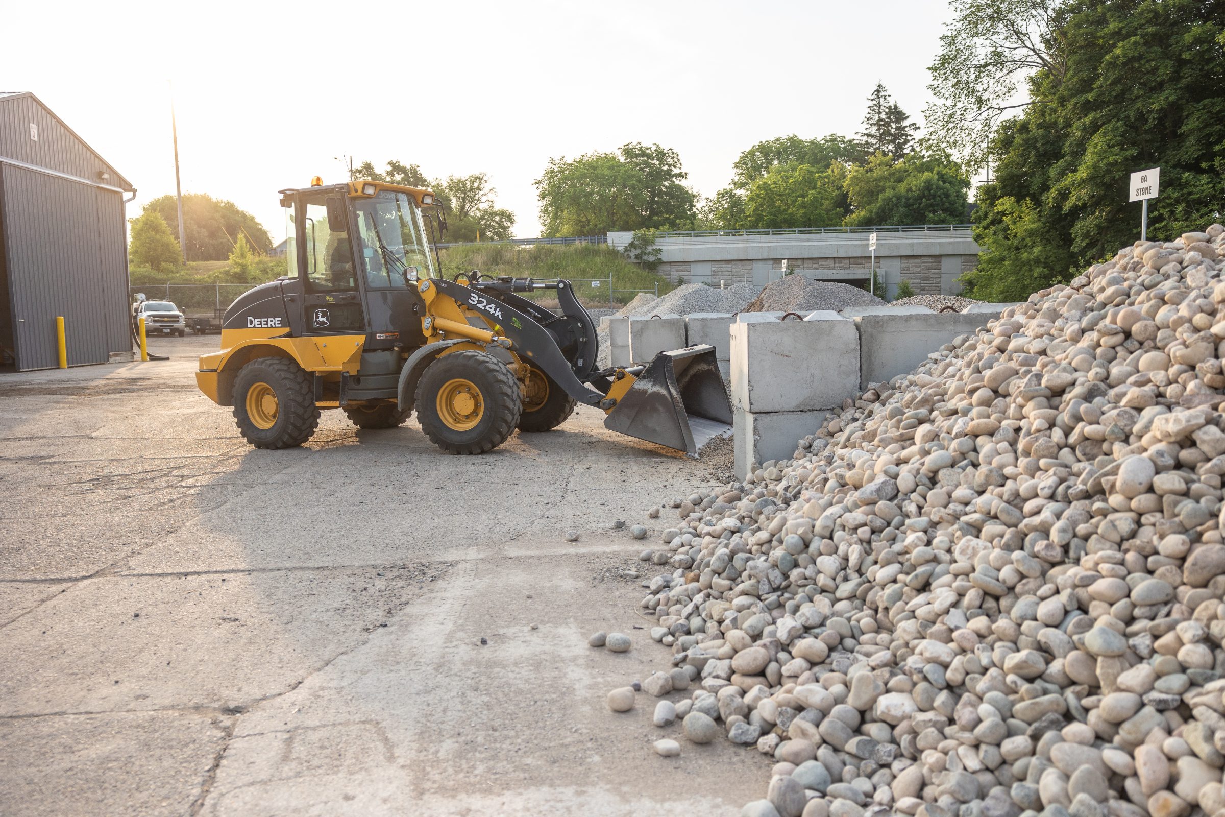 Loader moving gravel at construction site