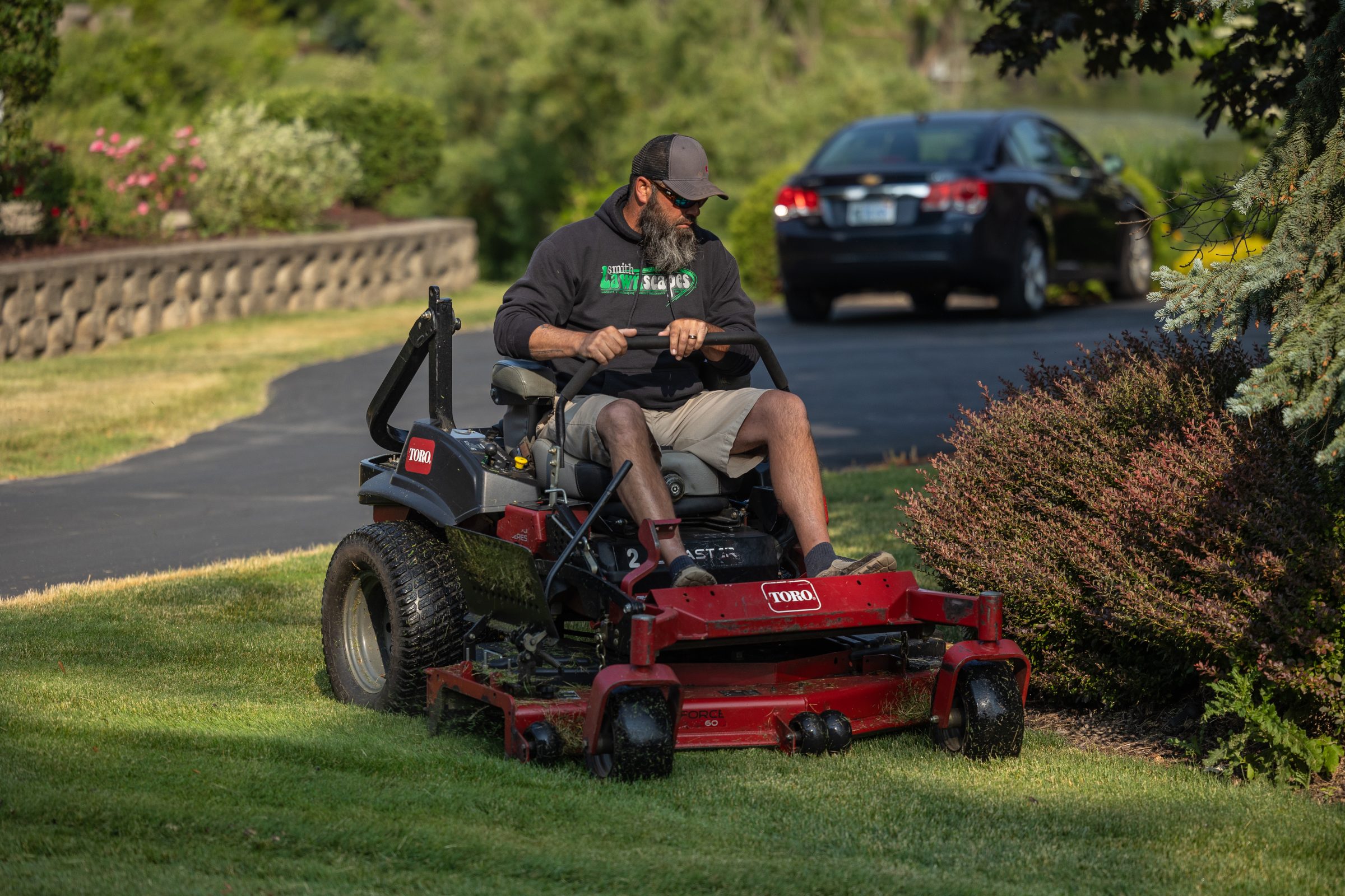 Man mowing lawn with riding mower