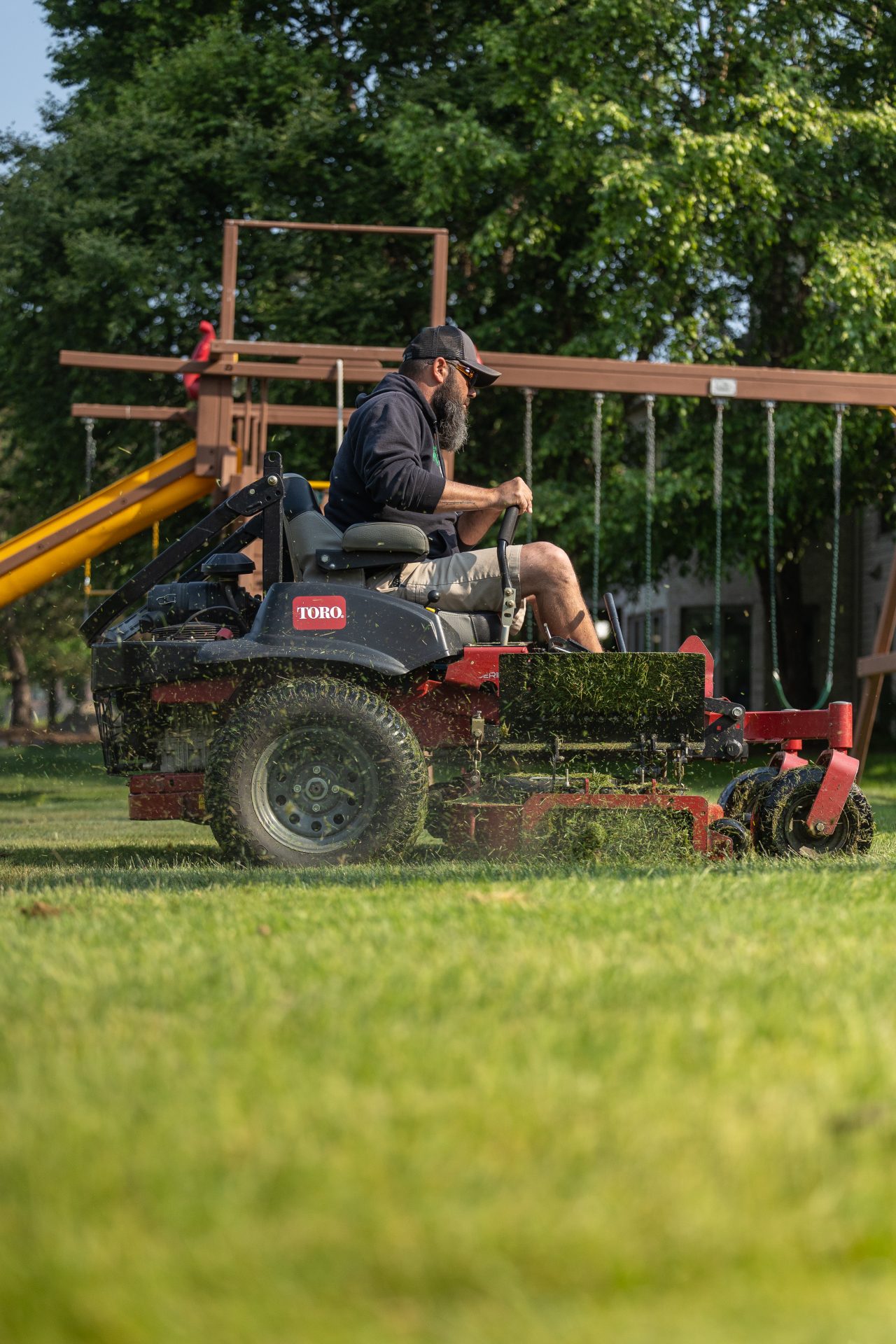 Man mowing lawn on riding mower