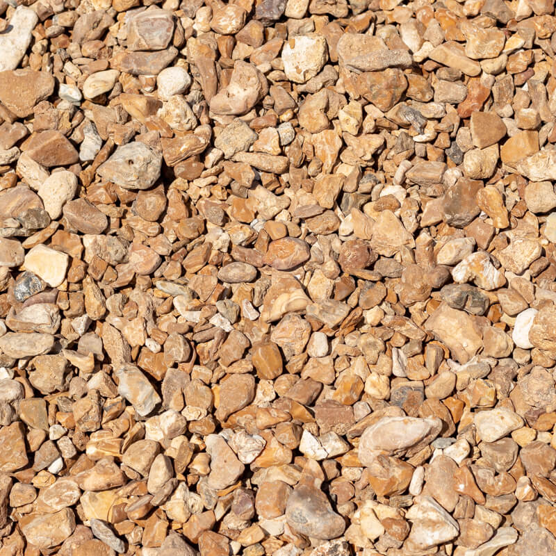 Close-up of brown gravel stones background.