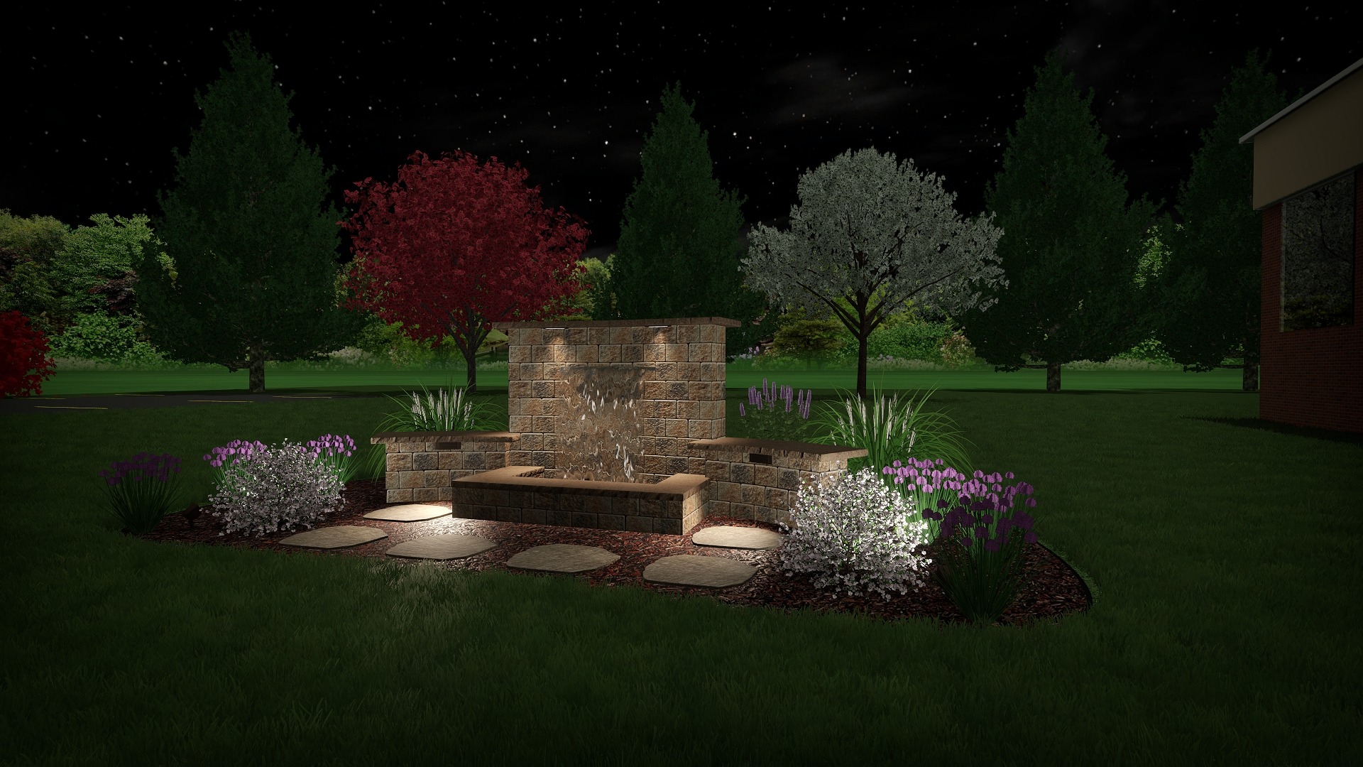 Nighttime garden with illuminated fountain and trees.
