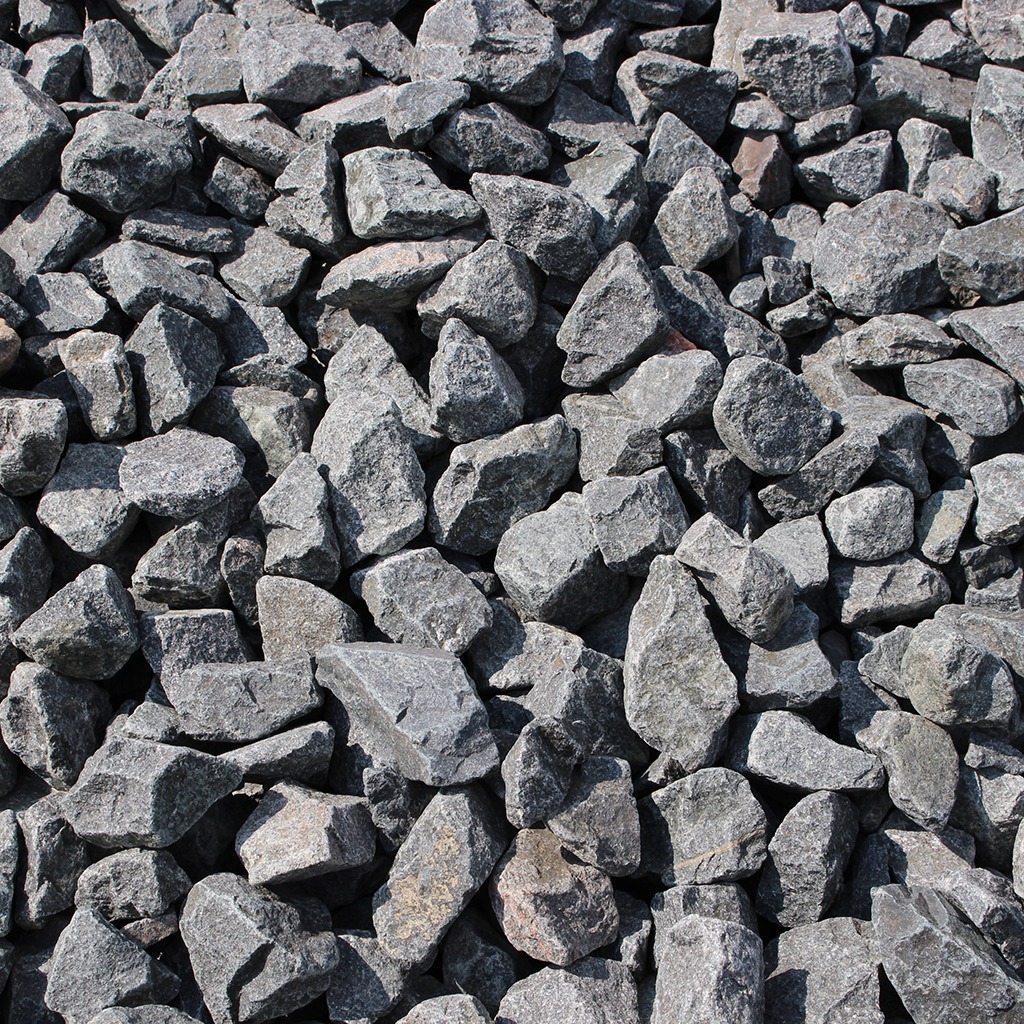 Pile of gray crushed stones piled together.