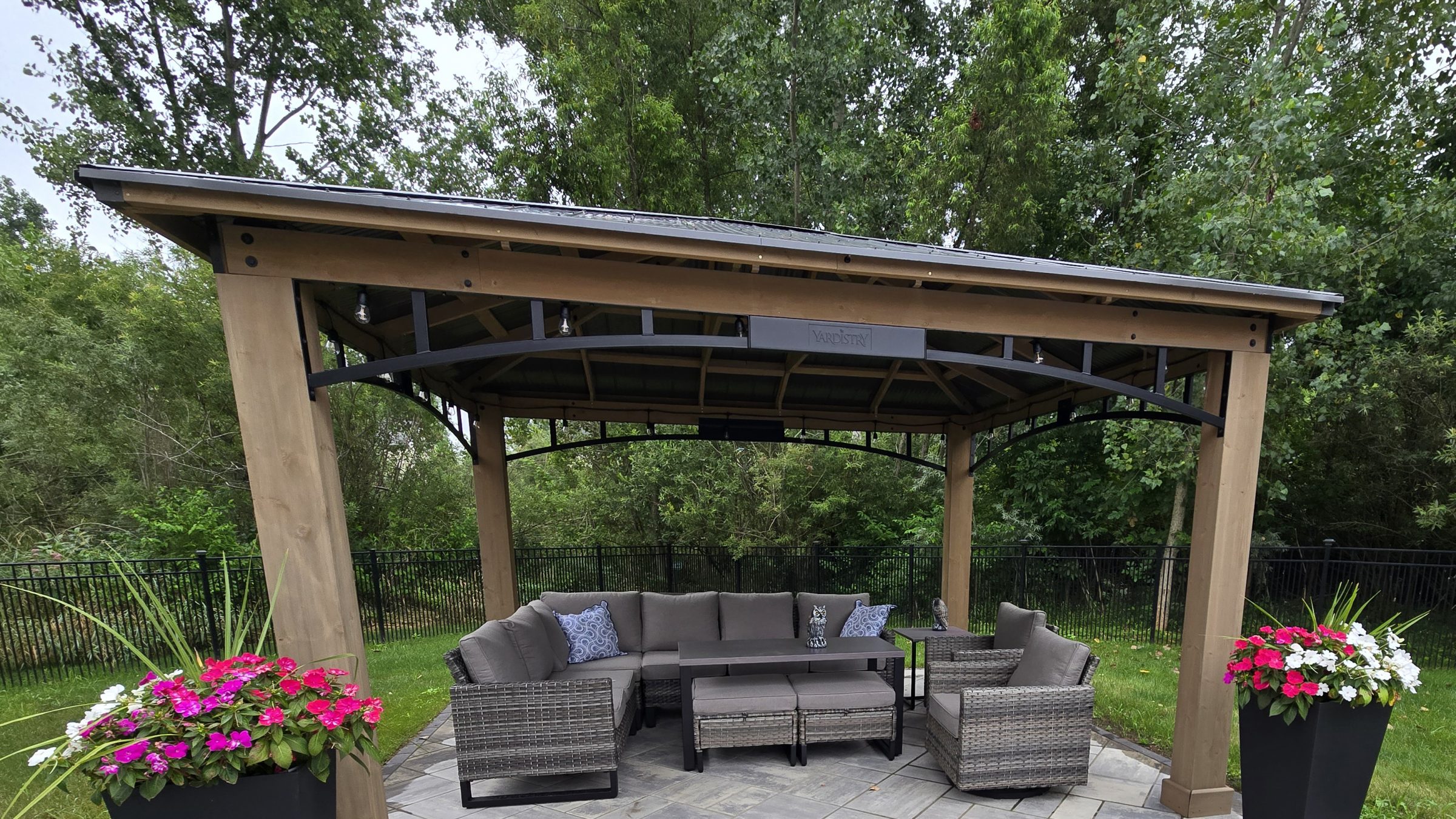 Outdoor gazebo with furniture and plants