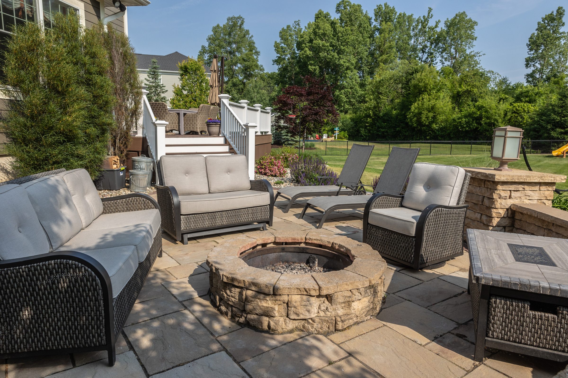 Outdoor patio with seating and fire pit.