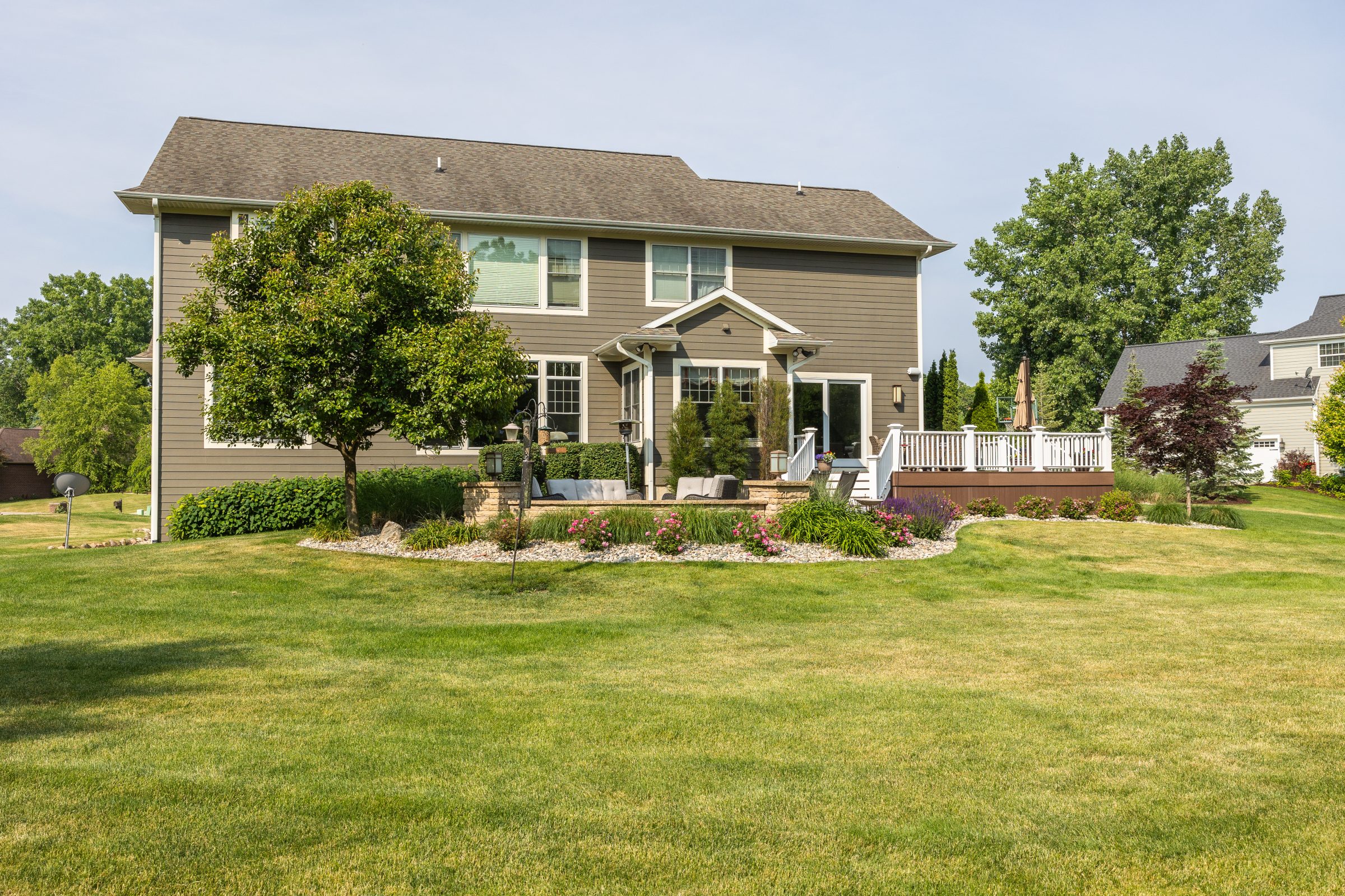 Suburban house with well-maintained lawn and garden