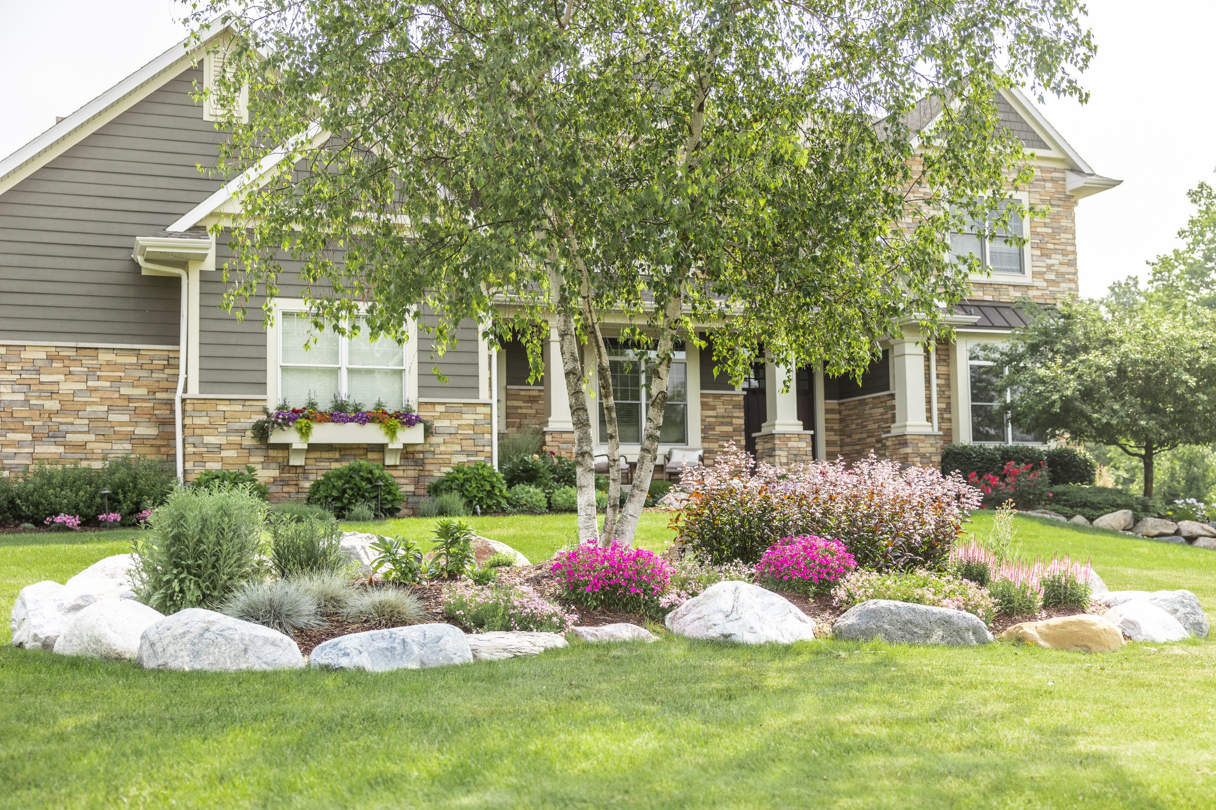 Beautiful garden with colorful flowers and trees.