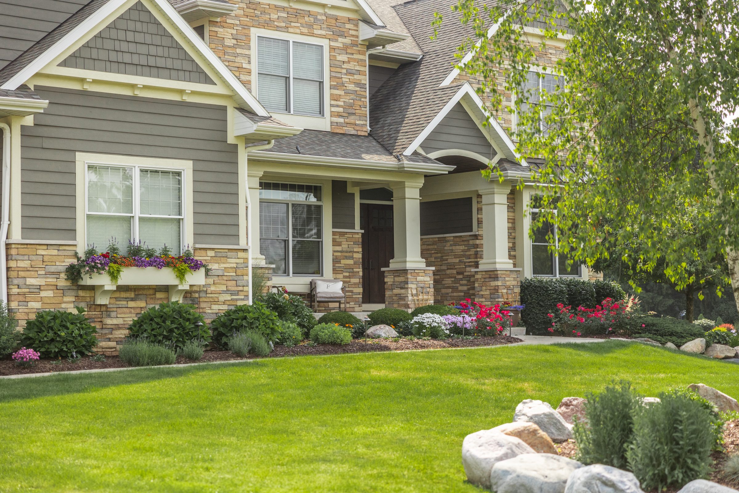Beautiful house with landscaped front yard garden.