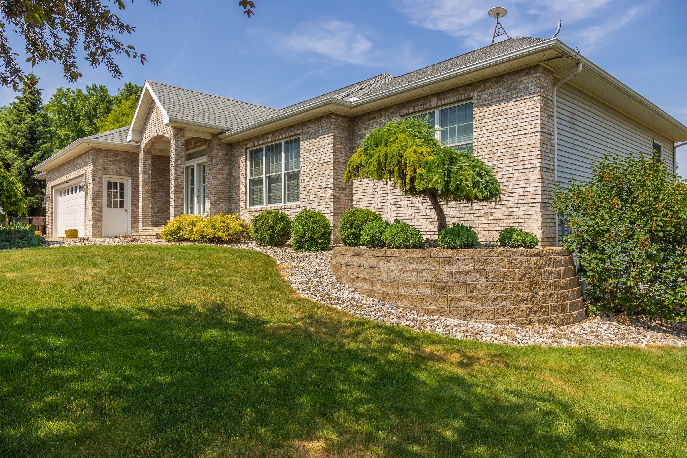 Modern brick house with lush garden