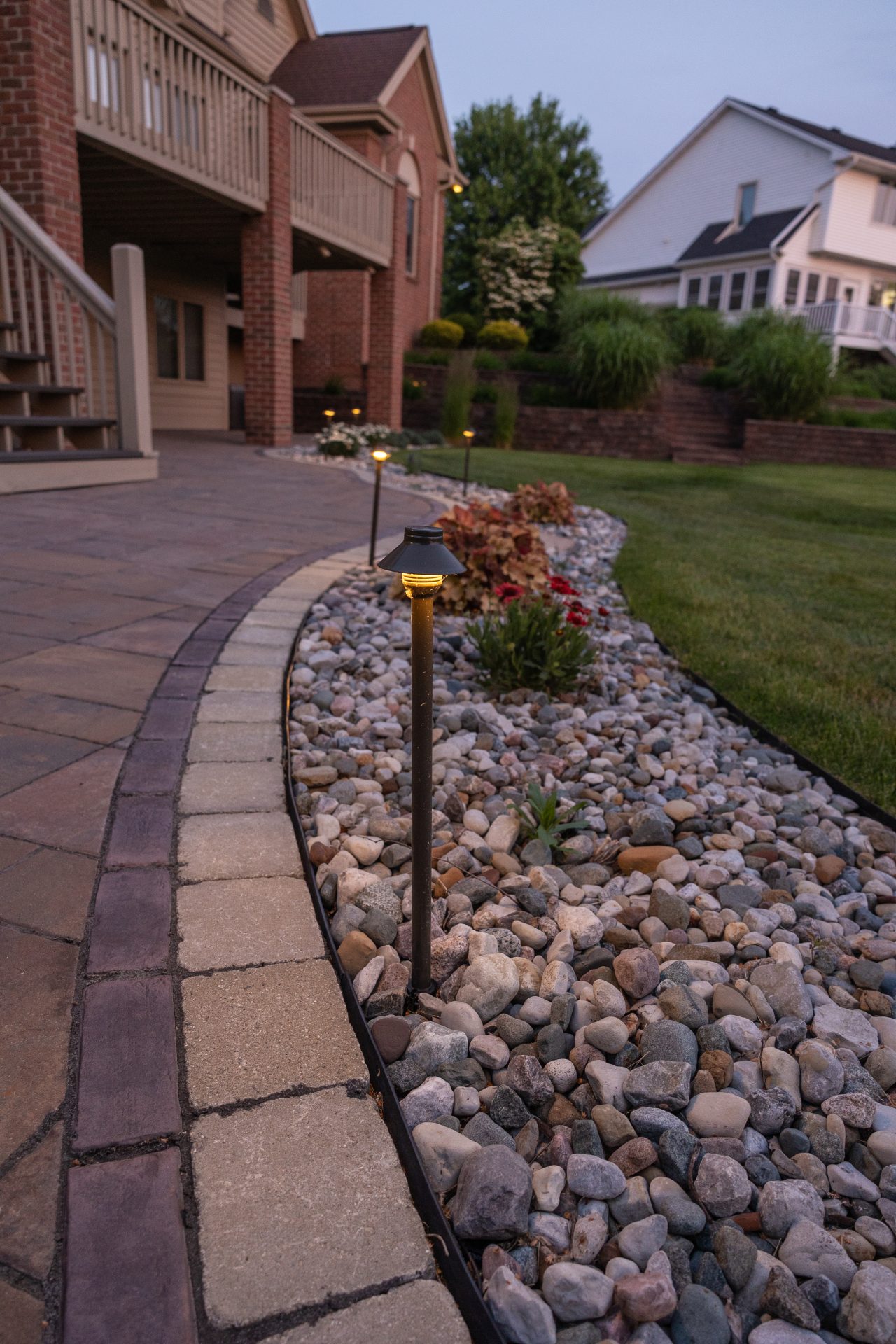Outdoor path with stone landscaping and lights
