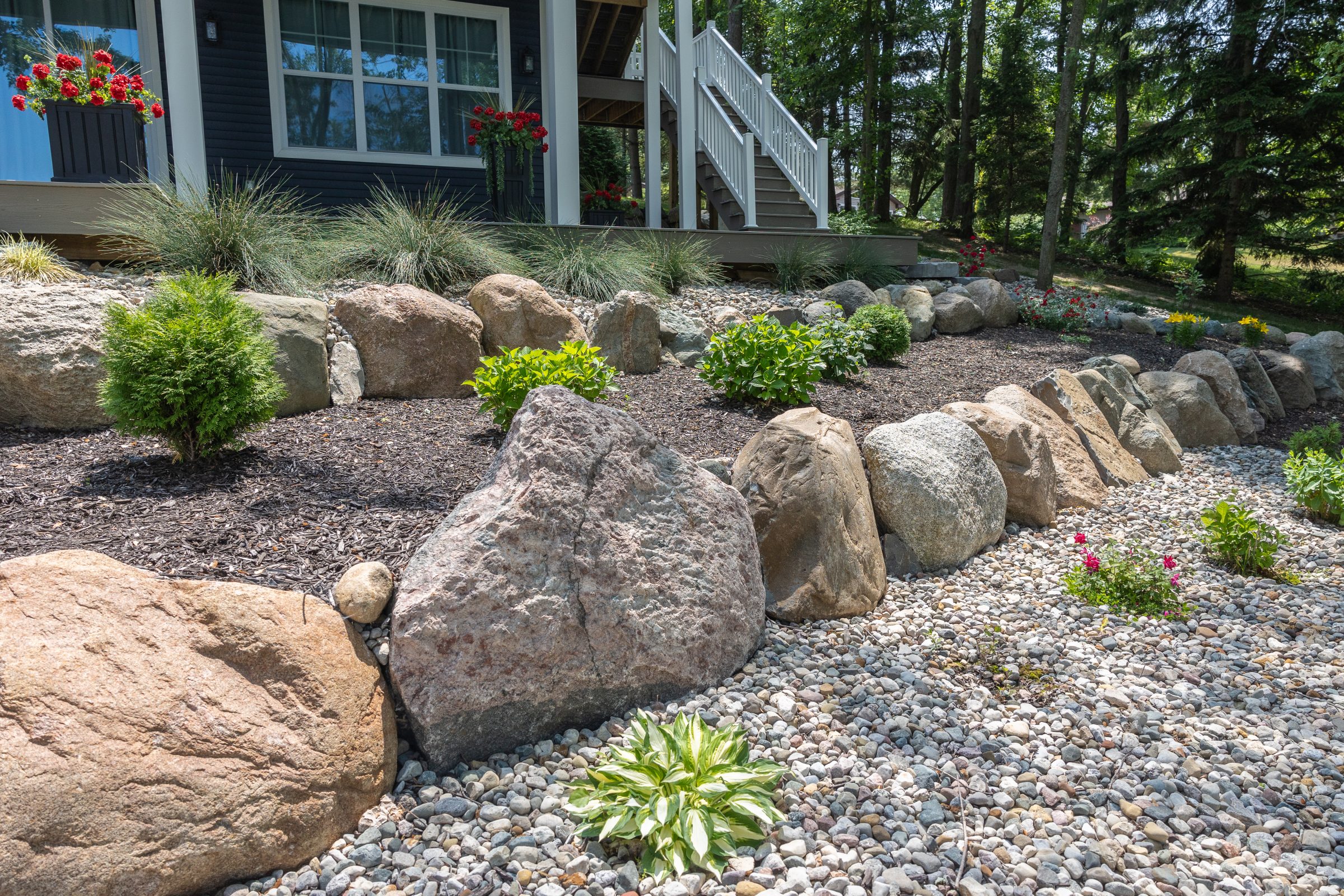 Rock garden landscaping with plants and flowers