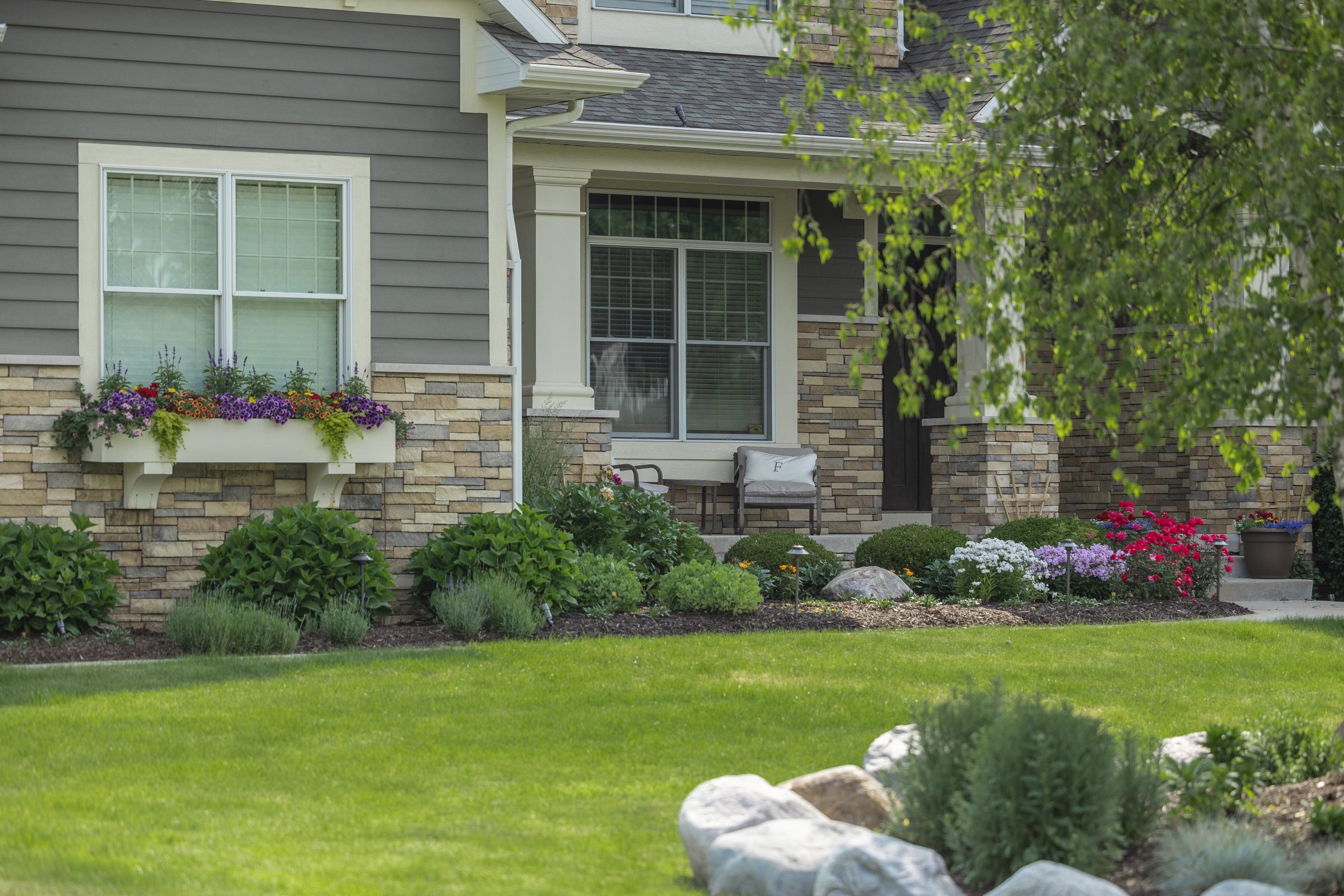 Beautiful house exterior with lush garden landscaping.
