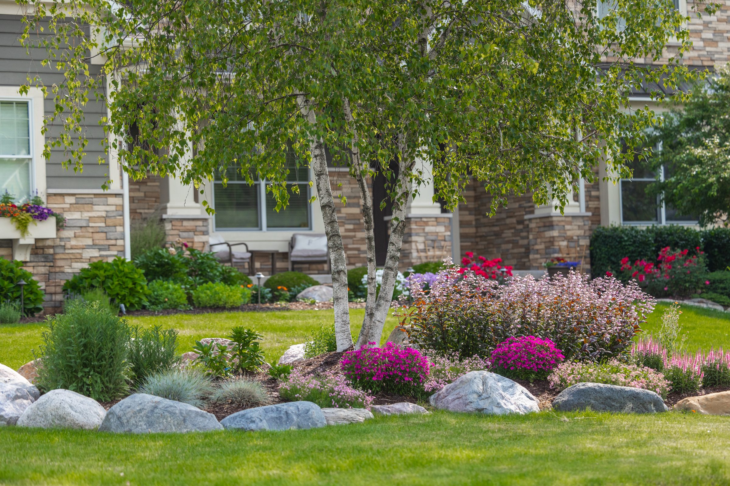 Beautiful garden landscaping with flowers and trees.