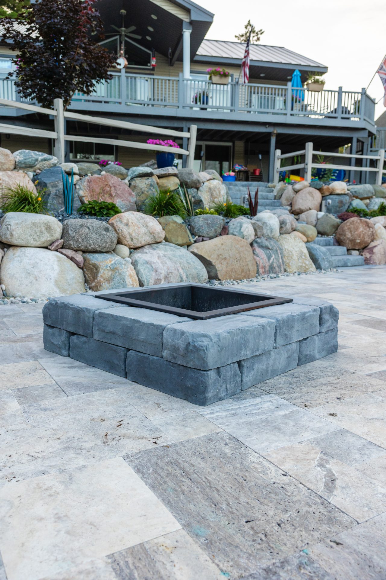 Stone fire pit on patio in backyard