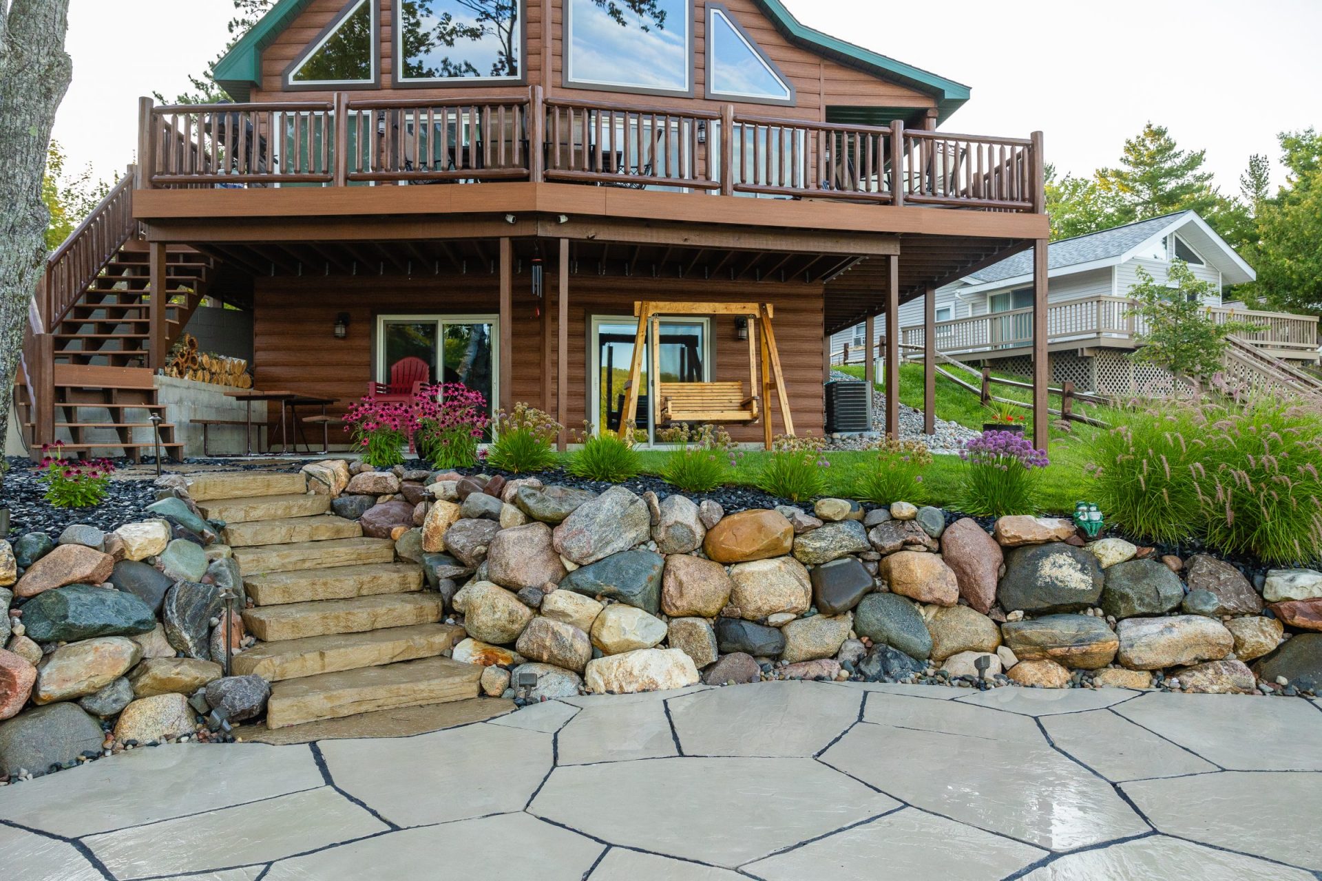 Natural stone steps enhance the beauty of the entrance 