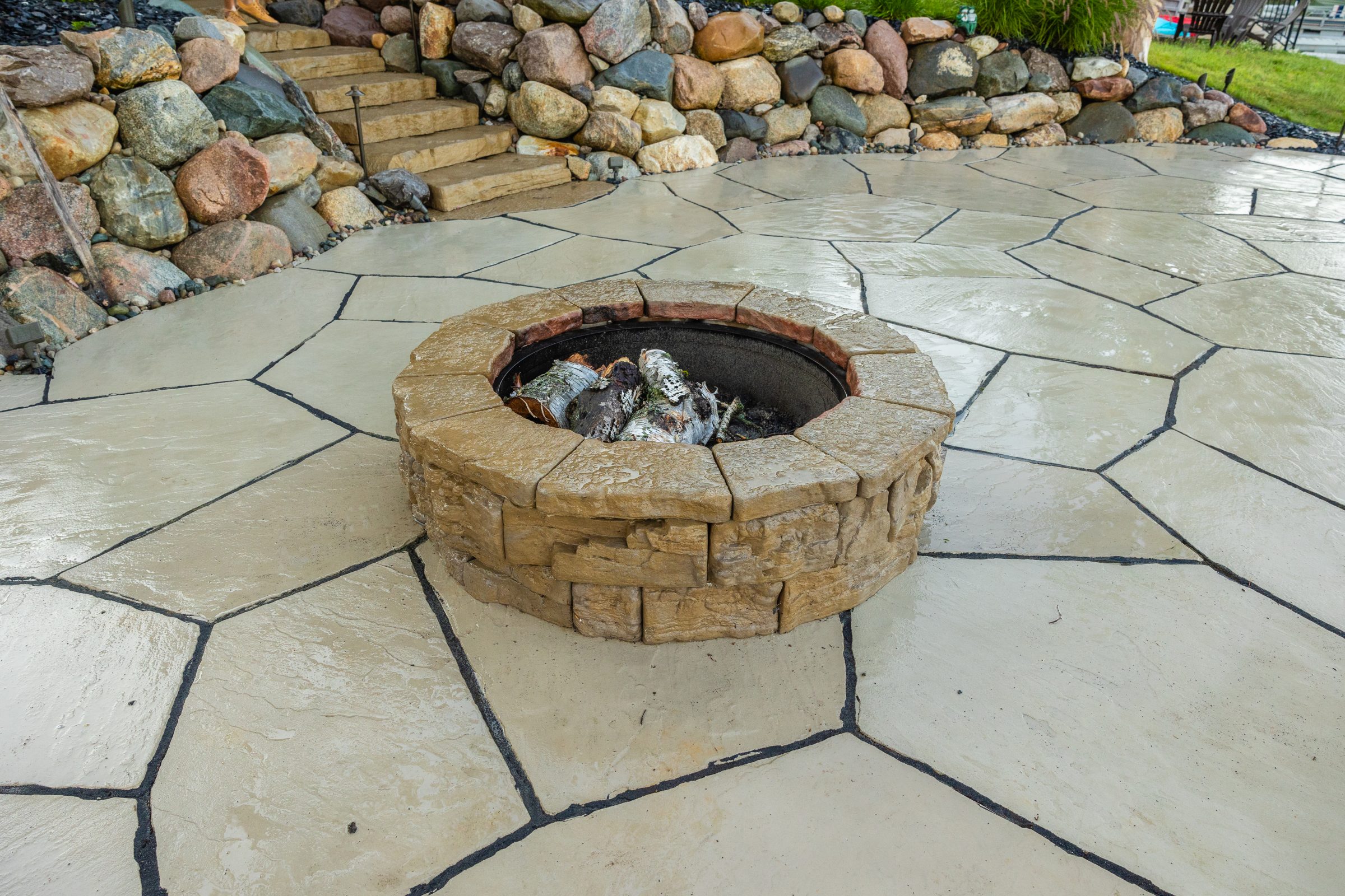 Outdoor stone fire pit on patio