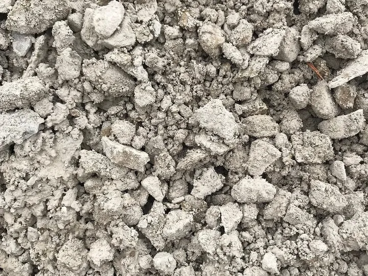 Gray cement chunks and gravel texture