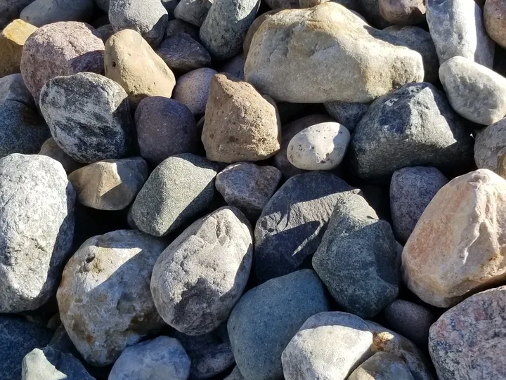 Close-up of assorted stones on ground.