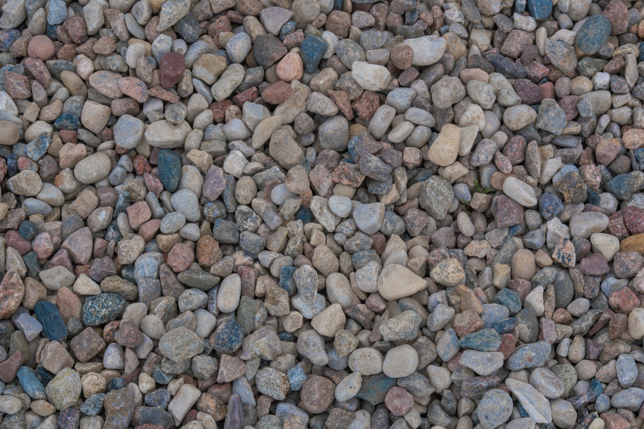 Close-up of colorful pebbles on ground.